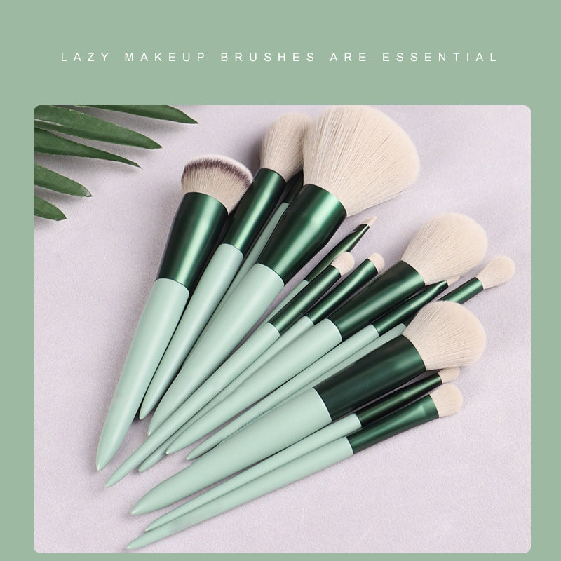 Set of makeup brushes with green handles on a light gray background, accompanied by text 'Lazy makeup brushes are essential'.