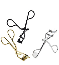 Three eyelash curlers in black, gold, and silver on a white background