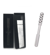 White body massage roller with black dots next to an open black box on a white background