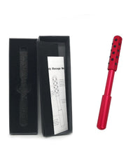 Red body massage roller with black dots in a black box on a white background