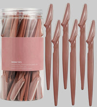 Set of pink plastic knives with a clear container labeled 'WARM TIPS' on a white background.